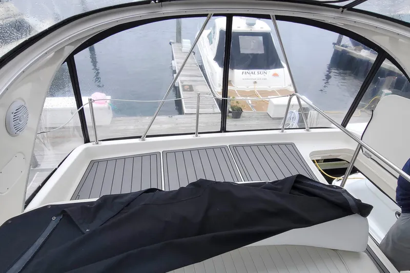 Slide: The Image of 2003 Meridian 411 Sedan yacht interior with docked boat view. - 4