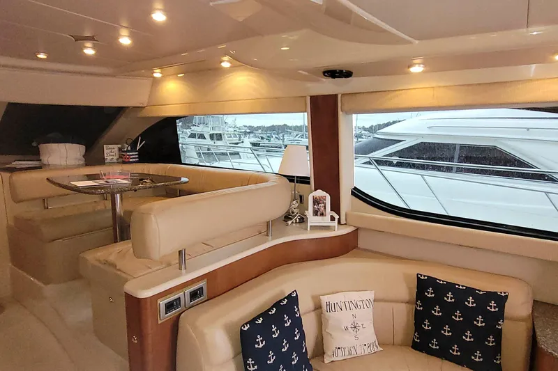 Slide: The Image of Luxurious interior of a 2003 Meridian 411 Sedan yacht with elegant seating and nautical decor. - 9