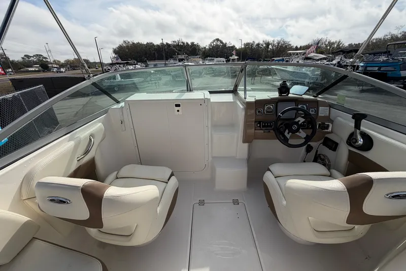 Slide: The Image of 2014 Chaparral 225 SSi boat interior with dual seats and steering console. - 16