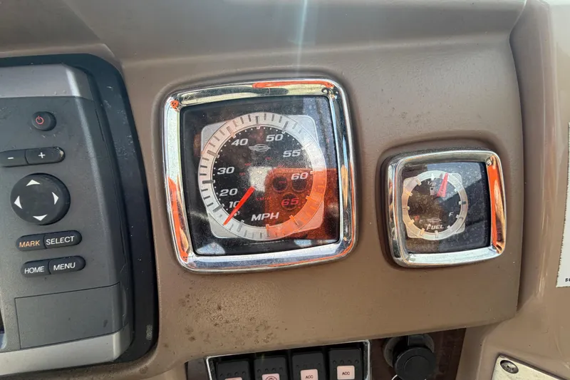 Slide: The Image of Dashboard of 2014 Chaparral 225 SSi with speedometer and fuel gauge. - 26