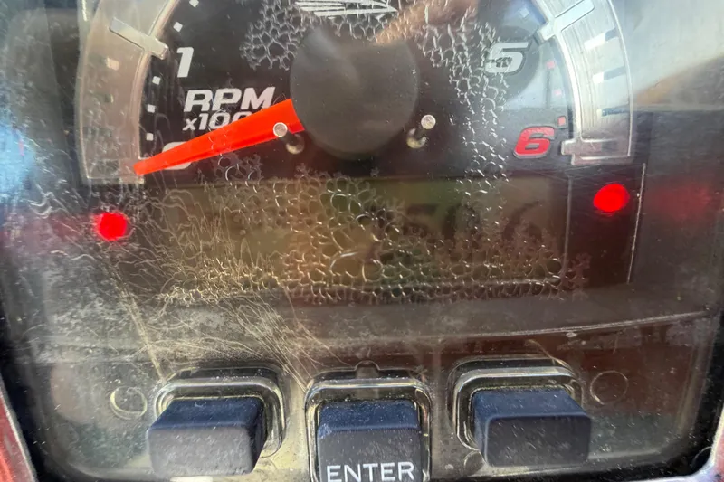 Slide: The Image of Close-up of 2014 Chaparral 225 SSi boat tachometer showing RPM and digital display. - 28