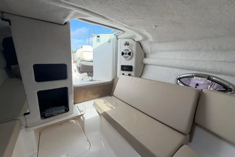 Slide: The Image of Interior of 2014 Chaparral 225 SSi boat with beige seating and speaker system. - 35