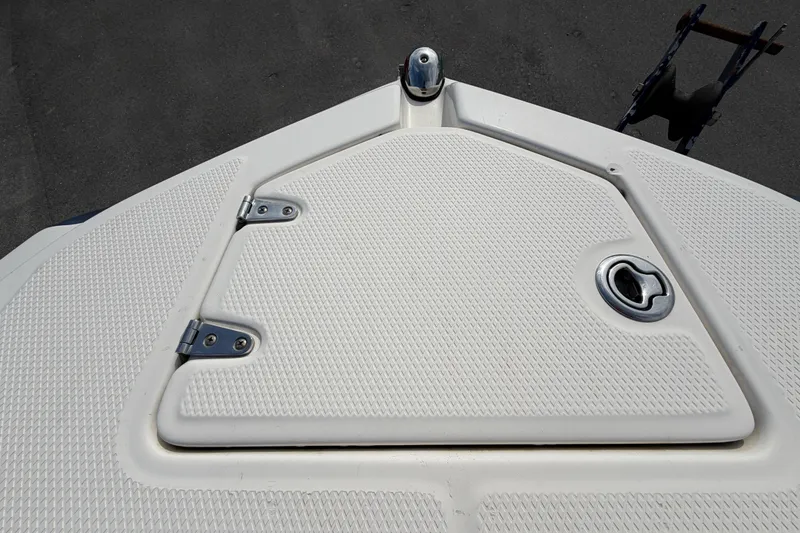 Slide: The Image of 2014 Chaparral 225 SSi boat deck with textured surface and metal fittings. - 37