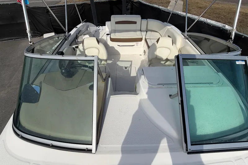 Slide: The Image of 2014 Chaparral 225 SSi boat interior with seating and open windshield. - 41