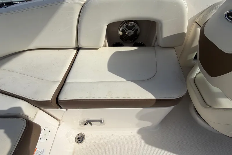 Slide: The Image of 2014 Chaparral 225 SSi boat interior seating with cup holders and speaker. - 46