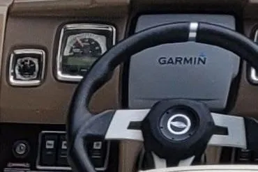 Slide: The Image of Steering wheel and dashboard of 2014 Chaparral 225 SSi with Garmin display. - 9