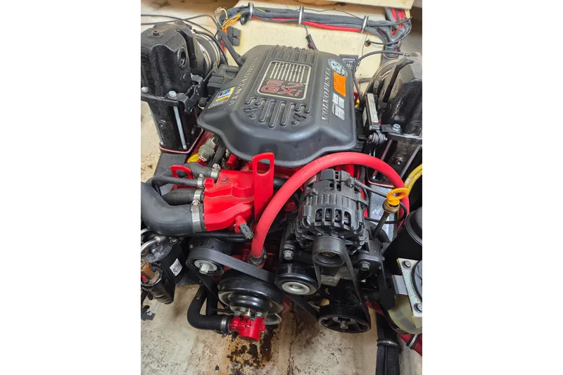 Slide: The Image of Engine of 2008 Chaparral Signature 250 boat, featuring Volvo Penta components. - 11