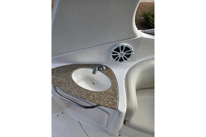 Slide: The Image of 2008 Chaparral Signature 250 boat interior with sink and speaker. - 12
