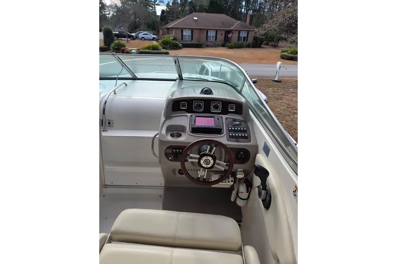 Slide: The Image of 2008 Chaparral Signature 250 boat cockpit with steering wheel and control panel. - 13