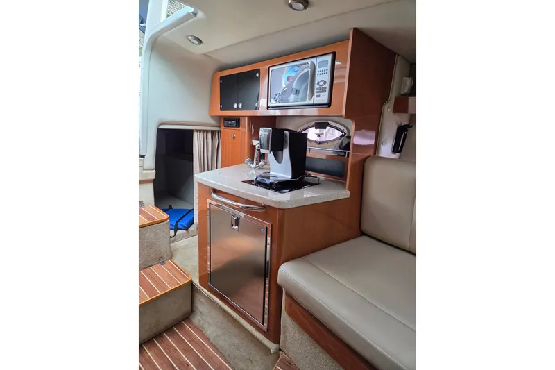Slide: The Image of 2008 Chaparral Signature 250 cabin interior with kitchenette and seating area. - 5