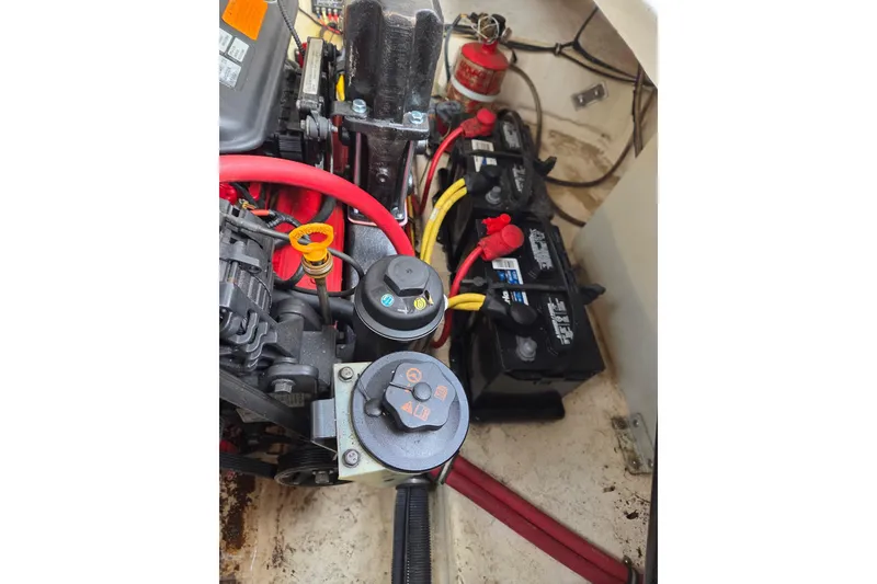 Slide: The Image of Engine compartment of a 2008 Chaparral Signature 250 with visible batteries and wiring. - 9