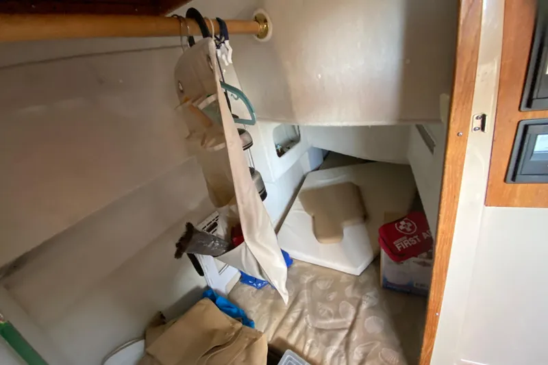 Slide: The Image of 2013 Ranger Tugs R-29 S interior cabin with storage and first aid kit. - 10