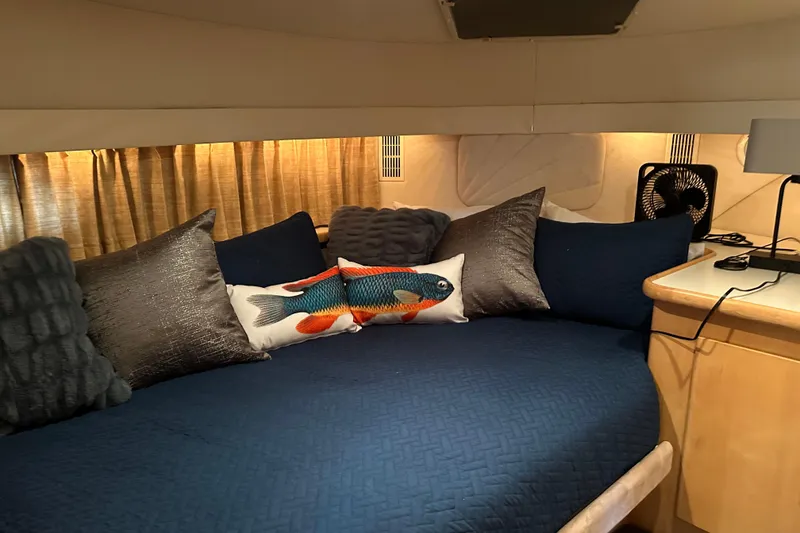 Slide: The Image of Cozy cabin interior of 1995 Carver 440 Aft Cabin Motor Yacht with plush pillows. - 26
