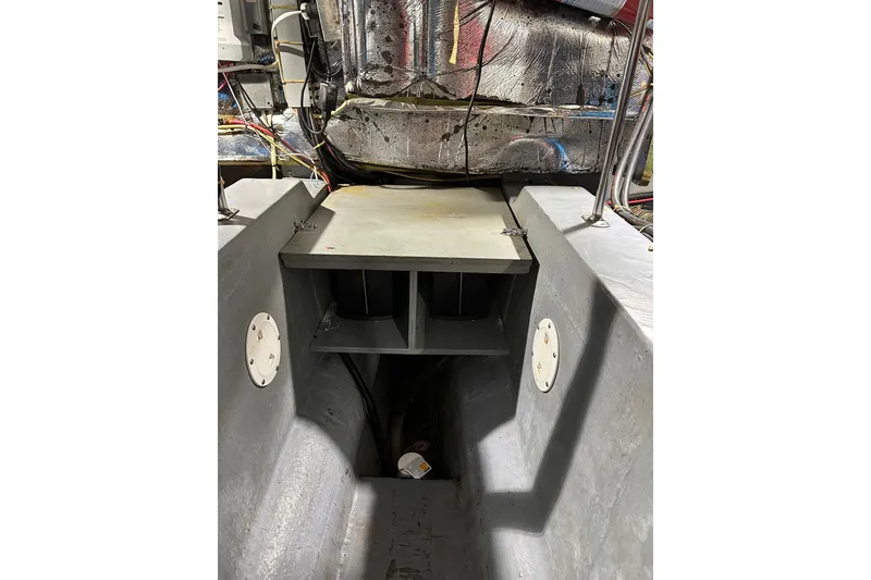 Slide: The Image of Engine compartment of 1995 Carver 440 Aft Cabin Motor Yacht, showcasing mechanical components. - 36