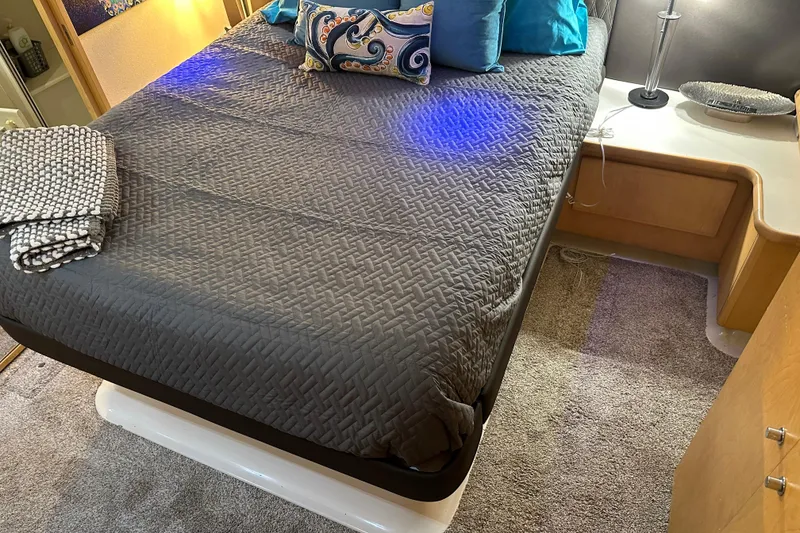 Slide: The Image of Cozy bedroom in 1995 Carver 440 Aft Cabin Motor Yacht with modern decor. - 49