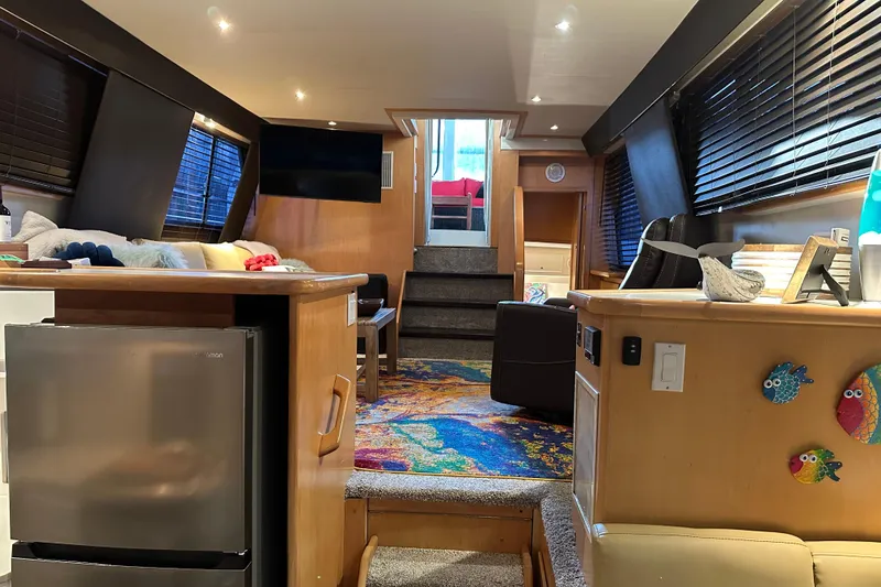 Slide: The Image of Interior of 1995 Carver 440 Aft Cabin Motor Yacht with modern amenities and colorful decor. - 51