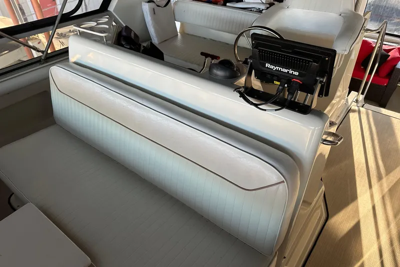 Slide: The Image of 1995 Carver 440 Aft Cabin Motor Yacht interior with Raymarine navigation system. - 16