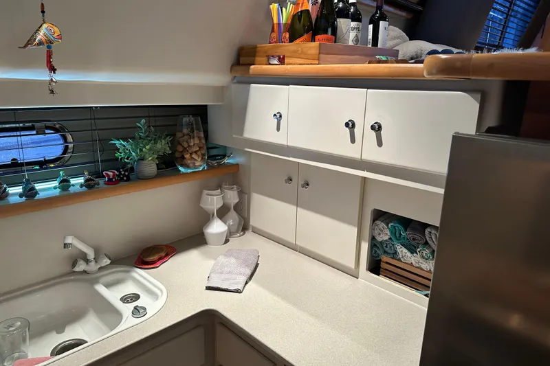 Slide: The Image of Cozy kitchen area in 1995 Carver 440 Aft Cabin Motor Yacht with modern amenities. - 27