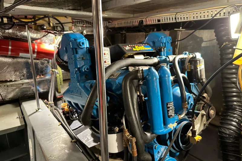 Slide: The Image of Engine room of 1995 Carver 440 Aft Cabin Motor Yacht with blue machinery. - 39