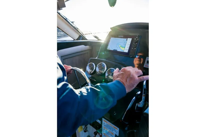 Slide: The Image of Helm of 2026 Trophy T29EX Explorer with navigation display and controls. - 26