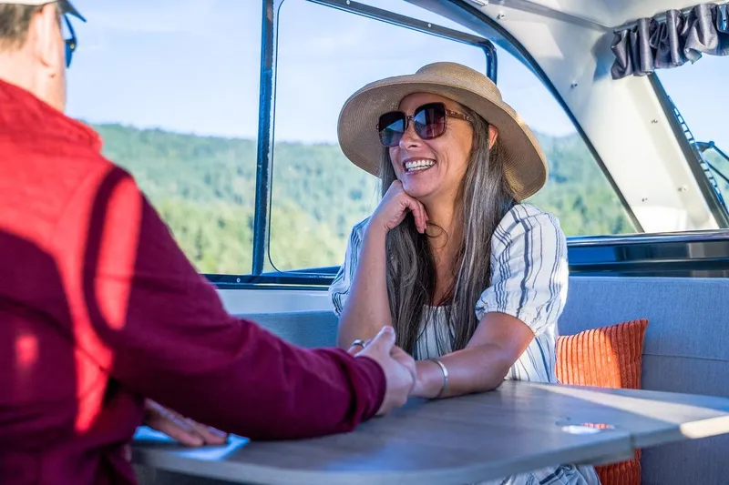 Slide: The Image of Woman smiling on a 2026 Trophy T29EX Explorer boat, enjoying a sunny day. - 31
