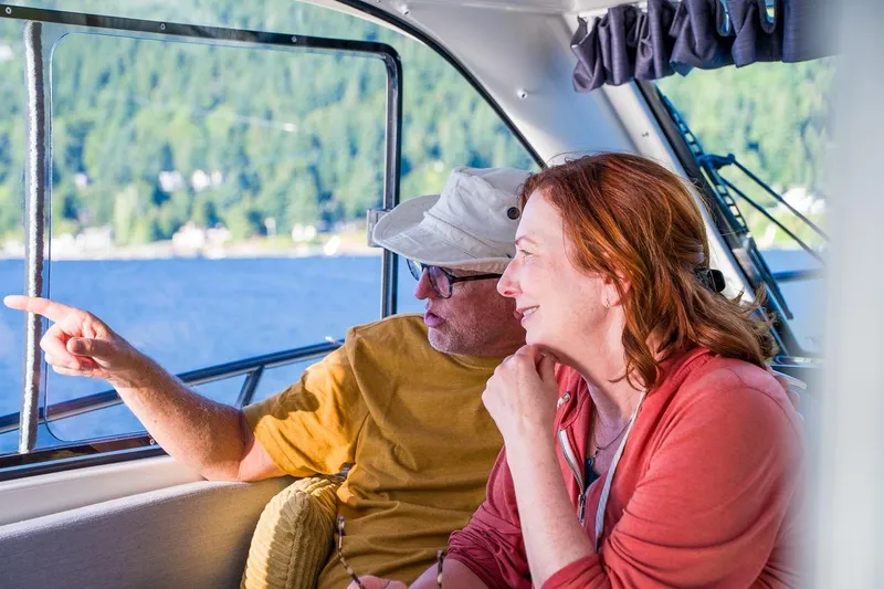 Slide: The Image of Couple enjoying scenic view from 2026 Trophy T29EX Explorer boat. - 32