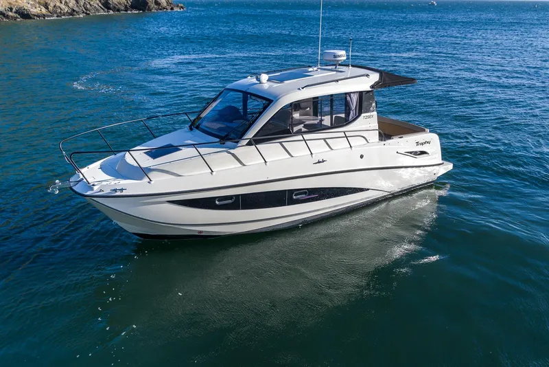 Slide: The Image of 2026 Trophy T29EX Explorer boat cruising on open water. - 4
