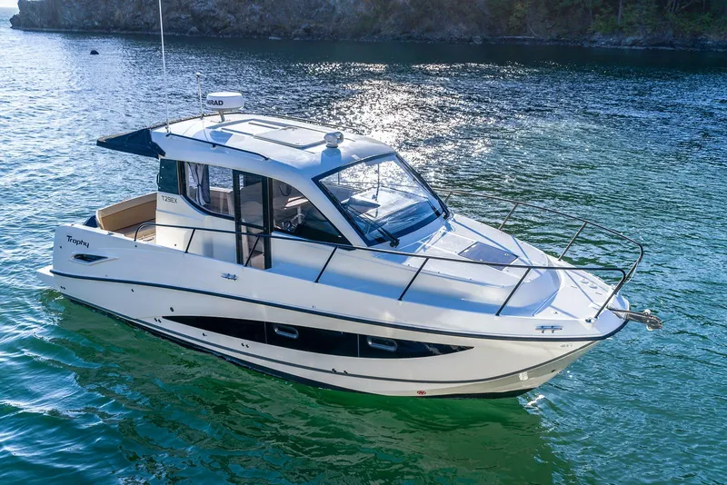 Slide: The Image of 2026 Trophy T29EX Explorer boat on serene water, showcasing sleek design and modern features. - 5