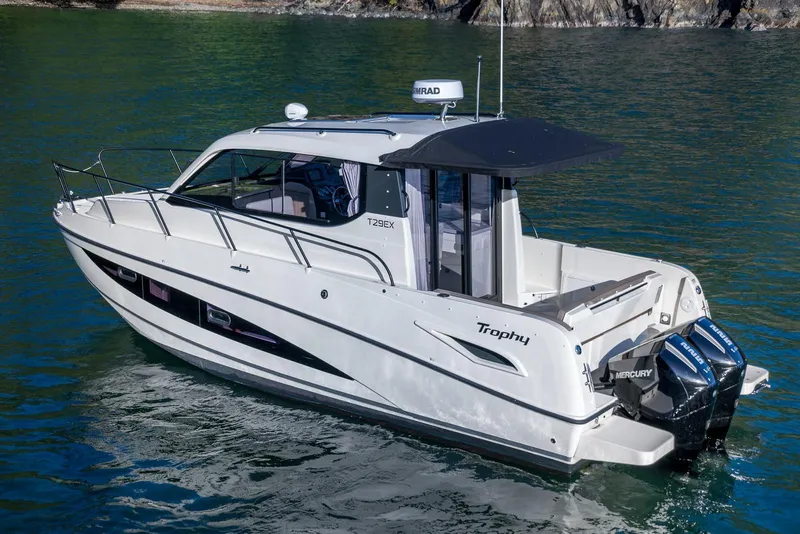 Slide: The Image of 2026 Trophy T29EX Explorer boat on water, featuring sleek design and dual Mercury engines. - 6