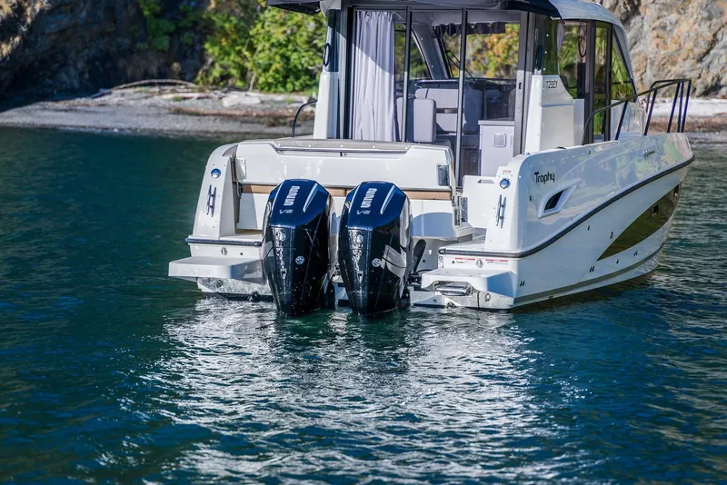 Slide: The Image of 2026 Trophy T29EX Explorer boat with dual Yamaha V8 engines on a serene water backdrop. - 9