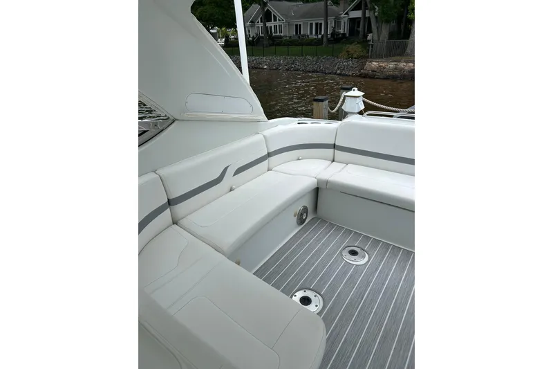 Slide: The Image of 2008 Formula 400 Super Sport boat interior with white seating and gray flooring. - 13