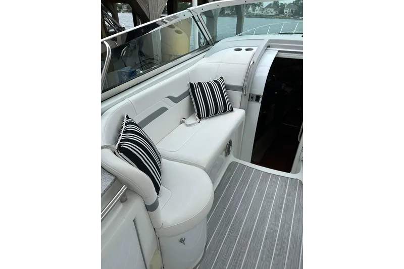 Slide: The Image of 2008 Formula 400 Super Sport boat interior with striped cushions and sleek seating. - 14