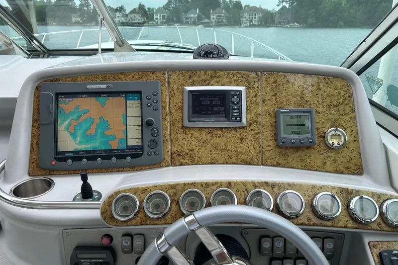 Slide: The Image of Dashboard of a 2008 Formula 400 Super Sport boat with navigation and depth displays. - 15