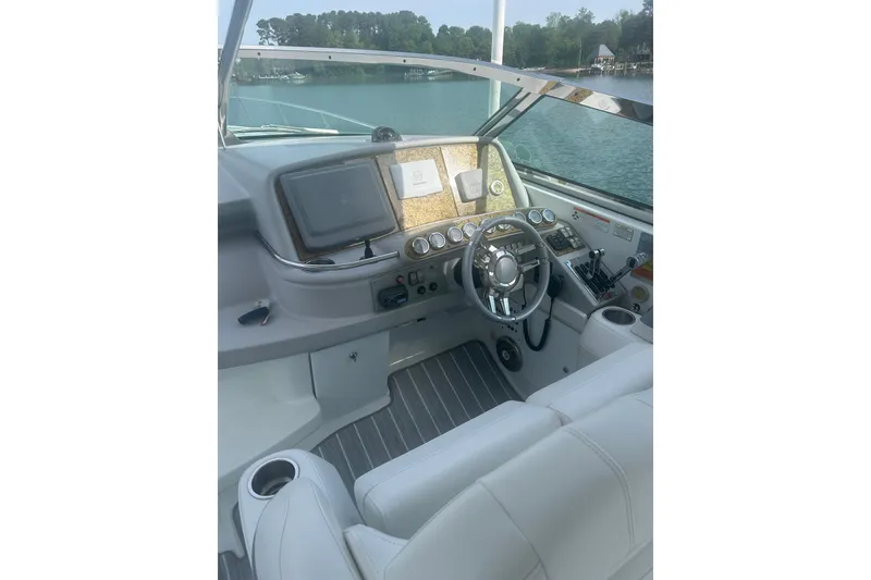 Slide: The Image of Cockpit of 2008 Formula 400 Super Sport boat with steering wheel and navigation controls. - 16