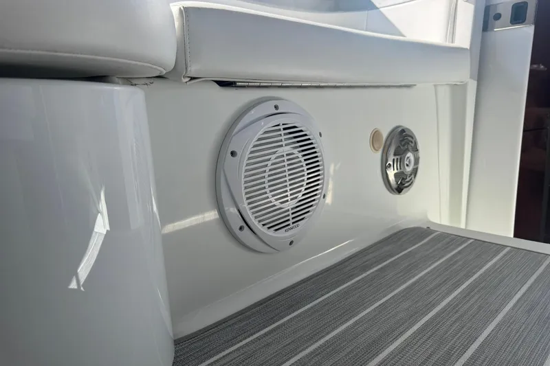 Slide: The Image of 2008 Formula 400 Super Sport boat interior with speakers and cushioned seating. - 19