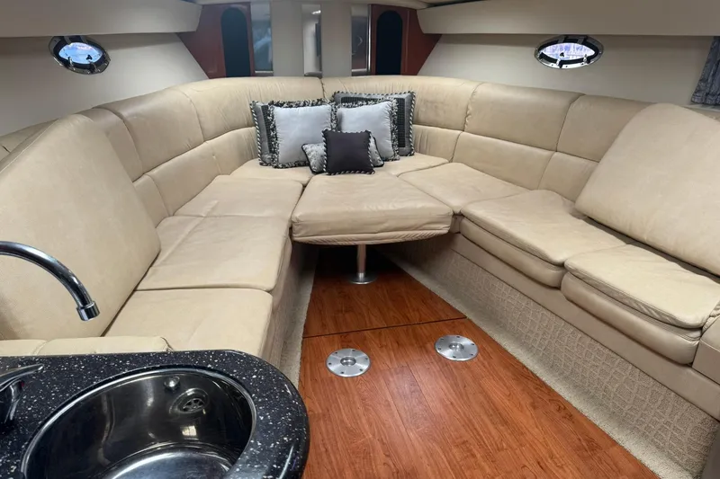 Slide: The Image of Luxurious interior of a 2008 Formula 400 Super Sport yacht with beige seating and wood flooring. - 21