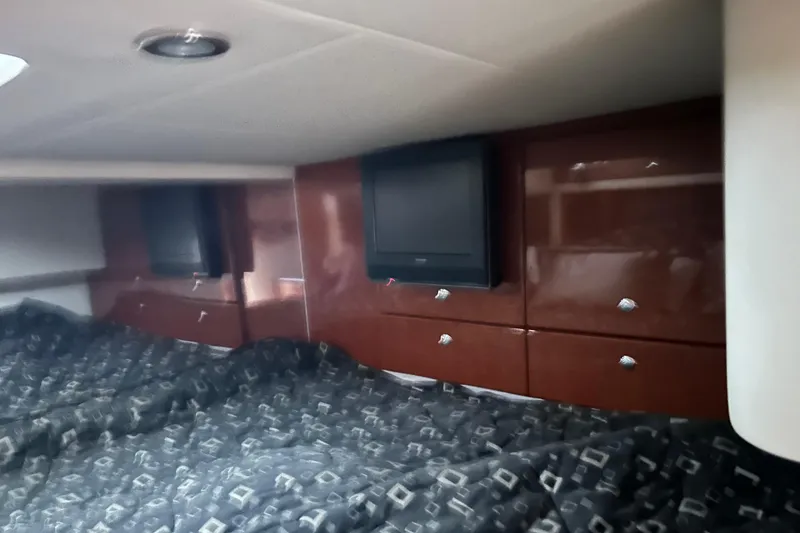 Slide: The Image of 2008 Formula 400 Super Sport cabin interior with TV and storage cabinets. - 23