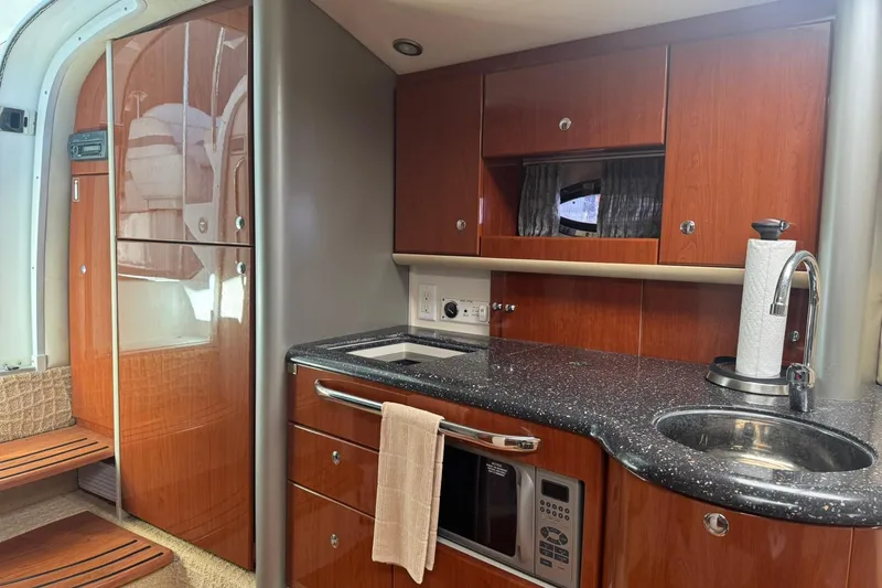 Slide: The Image of Luxurious 2008 Formula 400 Super Sport yacht interior with modern kitchen amenities. - 26