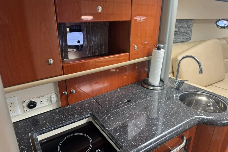 Slide: The Image of Interior of 2008 Formula 400 Super Sport yacht with kitchenette and seating area. - 28