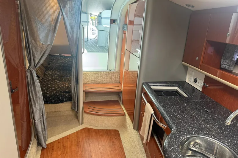 Slide: The Image of Interior of a 2008 Formula 400 Super Sport boat with kitchen and sleeping area. - 29