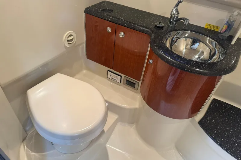 Slide: The Image of 2008 Formula 400 Super Sport boat bathroom with sink and toilet. - 30
