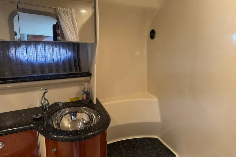 Slide: The Image of 2008 Formula 400 Super Sport yacht bathroom with sink and mirror. - 31