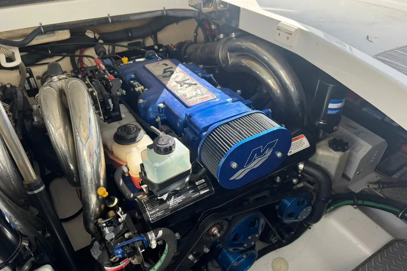 Slide: The Image of Engine compartment of a 2008 Formula 400 Super Sport boat, featuring a blue engine. - 41