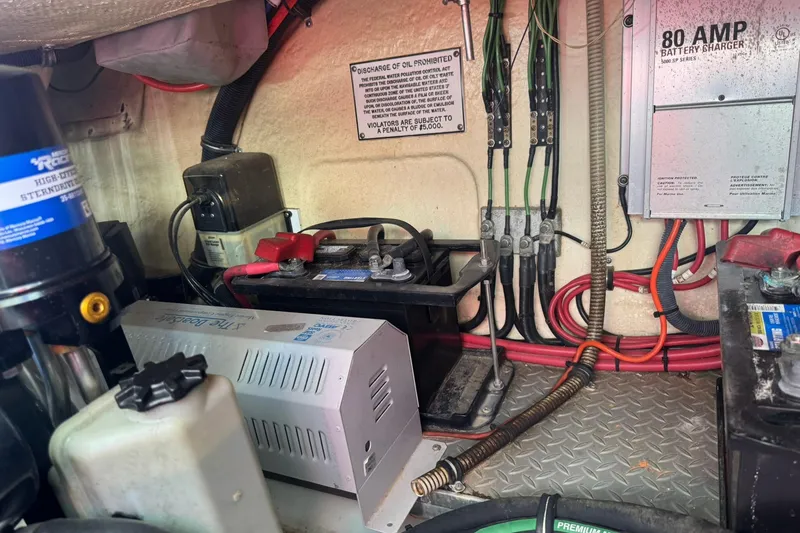 Slide: The Image of Engine compartment of a 2008 Formula 400 Super Sport with battery charger and wiring. - 42