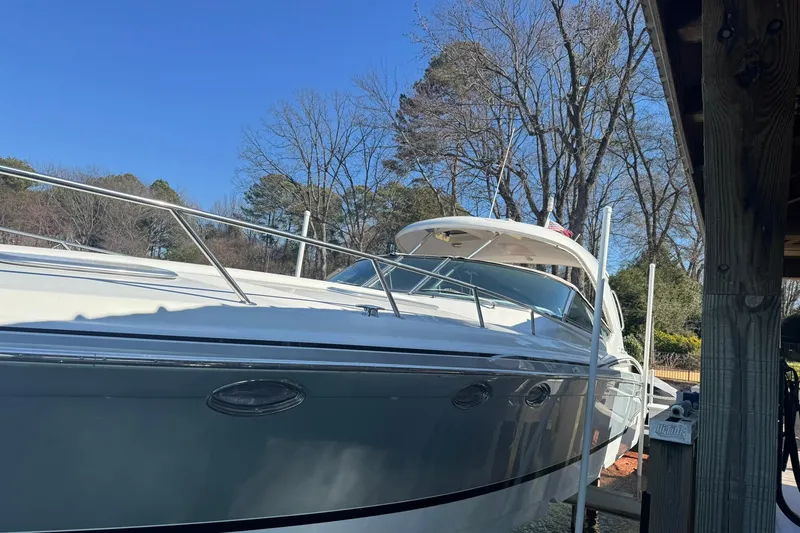 Slide: The Image of 2008 Formula 400 Super Sport boat docked under clear blue sky. - 6