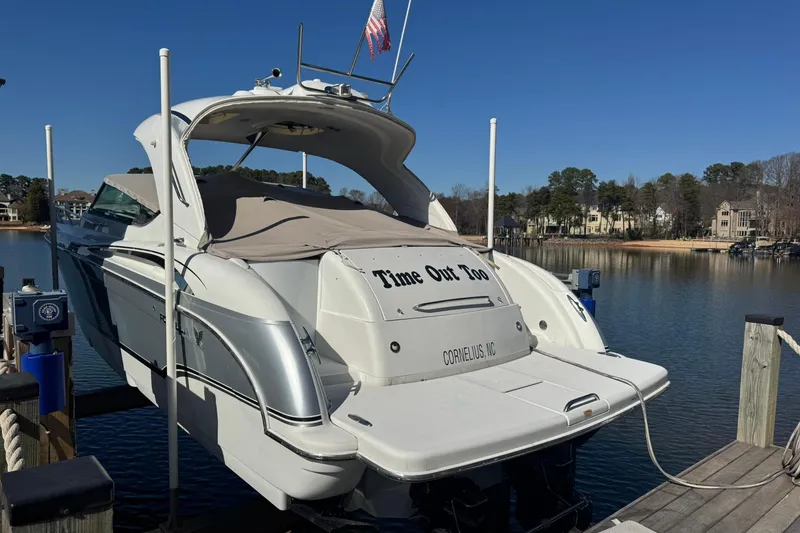 Slide: The Image of 2008 Formula 400 Super Sport boat docked on a sunny day, rear view. - 7