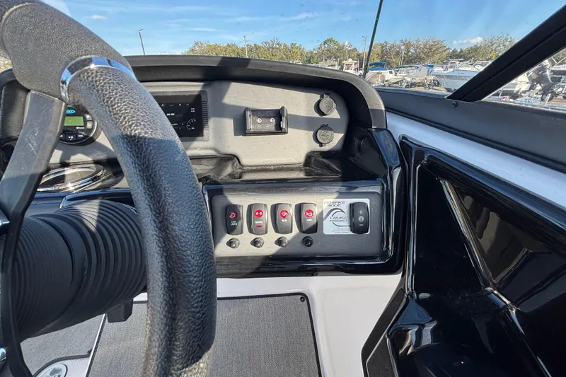 Slide: The Image of 2022 Yamaha Boats SX195 dashboard with steering wheel and control panel. - 27