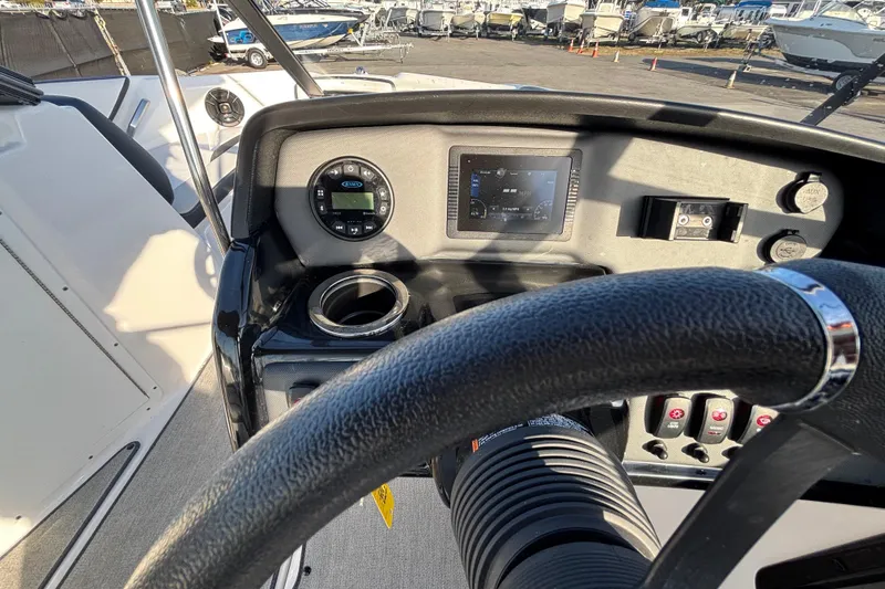 Slide: The Image of 2022 Yamaha Boats SX195 dashboard with steering wheel and control panel. - 29