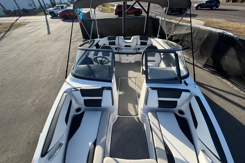 Slide: The Image of 2022 Yamaha Boats SX195 interior view with seating and steering wheel. - 48