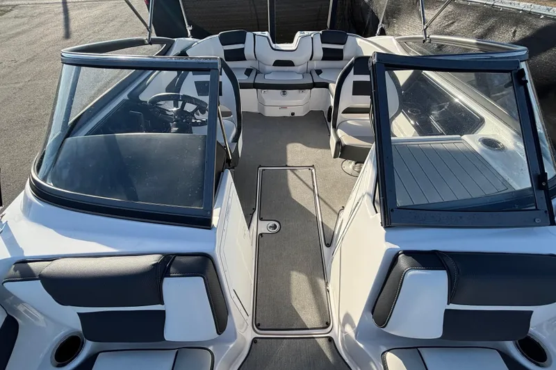 Slide: The Image of 2022 Yamaha Boats SX195 interior with seating and steering wheel, showcasing modern design. - 51